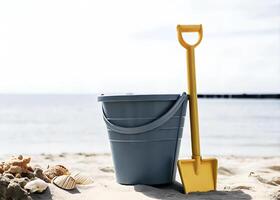 A bucket and shovel for building sandcastles on the beach photo