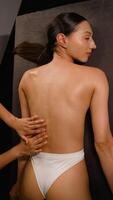 Top view of relaxing back massage in a serene spa environment video