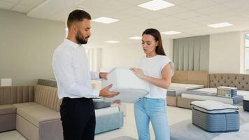 Sales Consultant Offers Discounted Mattress to Customer video