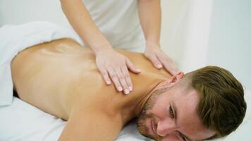 Close-Up of Male Back Massage for Relaxation in Spa Setting video