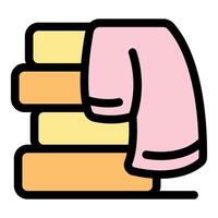 Pink towel hanging on stack of folded towels in bathroom or spa vector