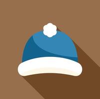 Blue winter hat with white pompom on brown background vector