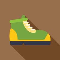 Green and yellow hiking boot with long shadow on brown background vector