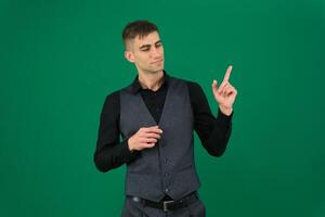 Portrait of a successful man holding something on the palms of the hands, isolated on a gray background photo