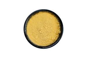 Fuller's earth in a bowl isolated on a white background. Top view. photo