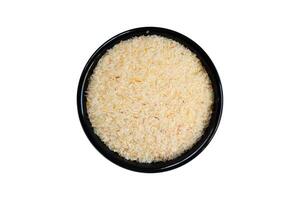 Psyllium husk in black bowl isolated on white background with clipping path. photo