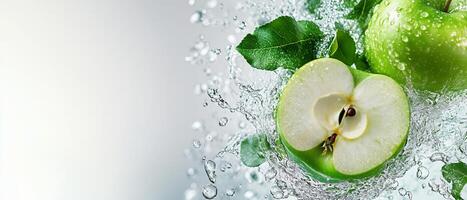 Fresh green apple splashes into water creating dynamic droplets and highlighting its crunchy texture photo