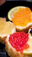 sandwiches with Rick caviar pike caviar sturgeon and salmon croquettes add lemon to sandwich garnish with lemon and herbs video
