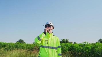 Engineer evaluates operations at industrial video