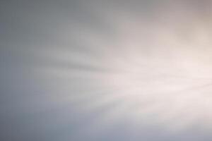 a white light is shining through a cloudy sky photo
