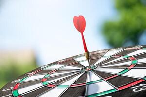 dart on target with blur background photo