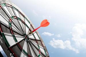 dart on target with sunlight background photo