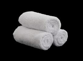 stack of three white face towel rolls isolated photo