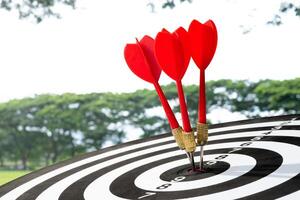 three dart arrow on target background photo