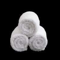 stack of white face towel rolls photo