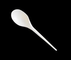 plastic spoon isolated on white photo