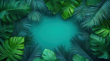Lush tropical greenery of palm and monstera leaves spreading across vivid teal color gradient background copy space for your text photo