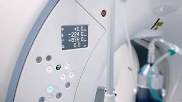 High-tech medical equipment with two capsules filled with contrast liquid for precise diagnostics. Cutting-edge technology in visualization and patient treatment. No people. Computed tomography scan video