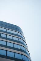 A tall building with a blue sky in the background photo
