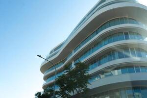 3TH NOVEMBER,2023,Cyprus,Nicosia. New building architecture on blue sky background,Low angle architectural exterior view of modern,copy space foe text photo