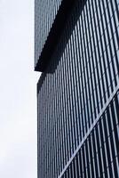 A black building with a clock on it photo