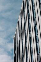 A building with windows and a sky background photo