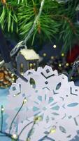 Gadget humanoid decorating Christmas tree. Artificial intelligence machine preparing paper snowflake for winter holidays. Robotic industry concept. Vertical video