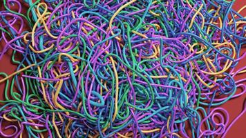 Vibrant Chaos. A Tangle of Colorful Rubber Bands on Contrasting Background photo