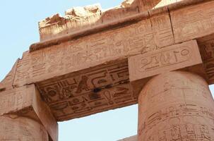 Part of the ancient Karnak Temple in Luxor, Egypt. Carved hieroglyphs on columns. photo