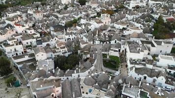 aerial view of Alberobello, a town with unique landscape. white roofs of trulli are embedded in the Italian landscape. From a drone you can see all beauty of this unique landscape of Alberobello. video