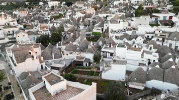 Drone flight offers stunning views of unique trulli architecture of Alberobello. Snow-white houses with conical roofs. beauty of Alberobello, shows graceful lines and harmony of trulli architecture. video