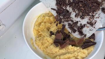 Making and Mixing Chocolate Chip Cookies dough in a transparent glass bowl in 4K. Concept of Preparing Chocolate Chip cookies step by step. video