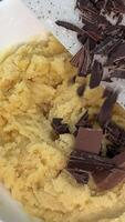 Making and Mixing Chocolate Chip Cookies dough in a transparent glass bowl in 4K. Concept of Preparing Chocolate Chip cookies step by step. video