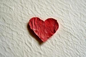 Vibrant red heart art piece celebrates love on a clean white canvas in a minimalistic design for Valentine's Day photo