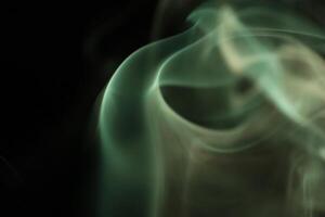 Green lines, green smoke on a dark background, colourful abstract, green fog, minimalism, line of light, smoke surface photo