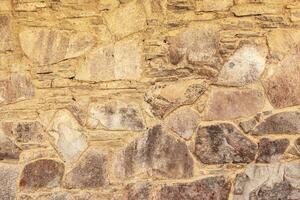 Texture of the stone wall. Background texture of the stone wall of the old building. Stone wall as background or texture. photo