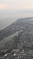 View of New York from an airplane. Haze. Vertical. View from the porthole photo