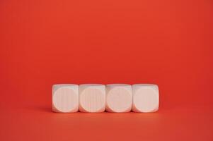 Wooden blocks on bright red background for creative text display photo