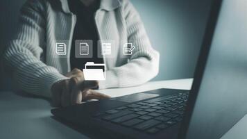 Document Management System, Officer using laptop manage files, Online document database management, automated processes to manage system, ERP enterprise efficient photo