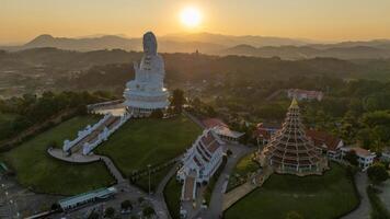 Aerial view of Wat Huay Pla Kang temple in Chiang Rai province of Thailand during sunset. This temple is a big complex made in Chinese style. photo