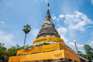 The sacred pagoda enshrined the Buddha's relics in Wat Phra Fang temple in Uttaradit province of Thailand. Built since 1700 B.E. during Sukhothai period. photo