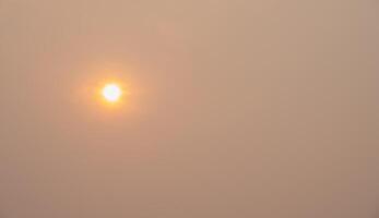 The sun rising behind the dust or foggy clouds. PM2.5 levels meaning the air quality posed a health hazard. photo