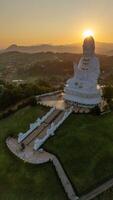 Aerial view of Big Guanyin statue in Wat Huay Pla Kang temple in Chiang Rai province of Thailand during sunset. This temple is a big complex made in Chinese style. photo