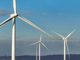 Wind energy and sustainable power generation with wind turbines, Eco-friendly solutions for renewable resources. Wind power farm and sustainable development of renewable energy, green technology photo