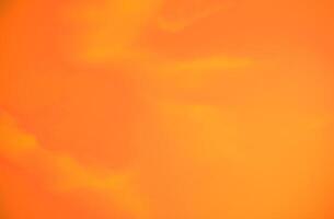 Vibrant orange sunset sky create a serene and tranquil atmosphere, ideal for climate and environmental concepts or as an emotional and psychological design background, evoking warmth and creativity. photo