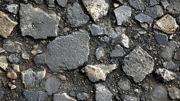 A close up of a stone wall with many different types of rocks photo