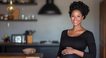 A pregnant woman stands in her modern kitchen with a warm smile. She gently cradles her baby bump while surrounded by a cozy, inviting atmosphere filled with natural light. photo