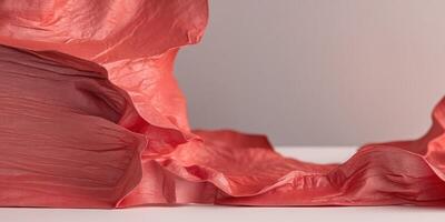A Textured Red Surface with Soft Gradient Light and Crinkled Edges creating Depth. photo