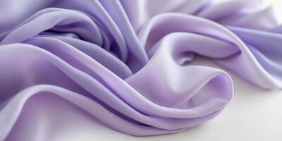 Soft flowing purple and lavender fabric folds with smooth elegant textures. photo