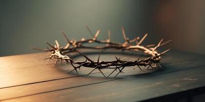 a crown of thorns is placed on a table with a light shining in the background. photo